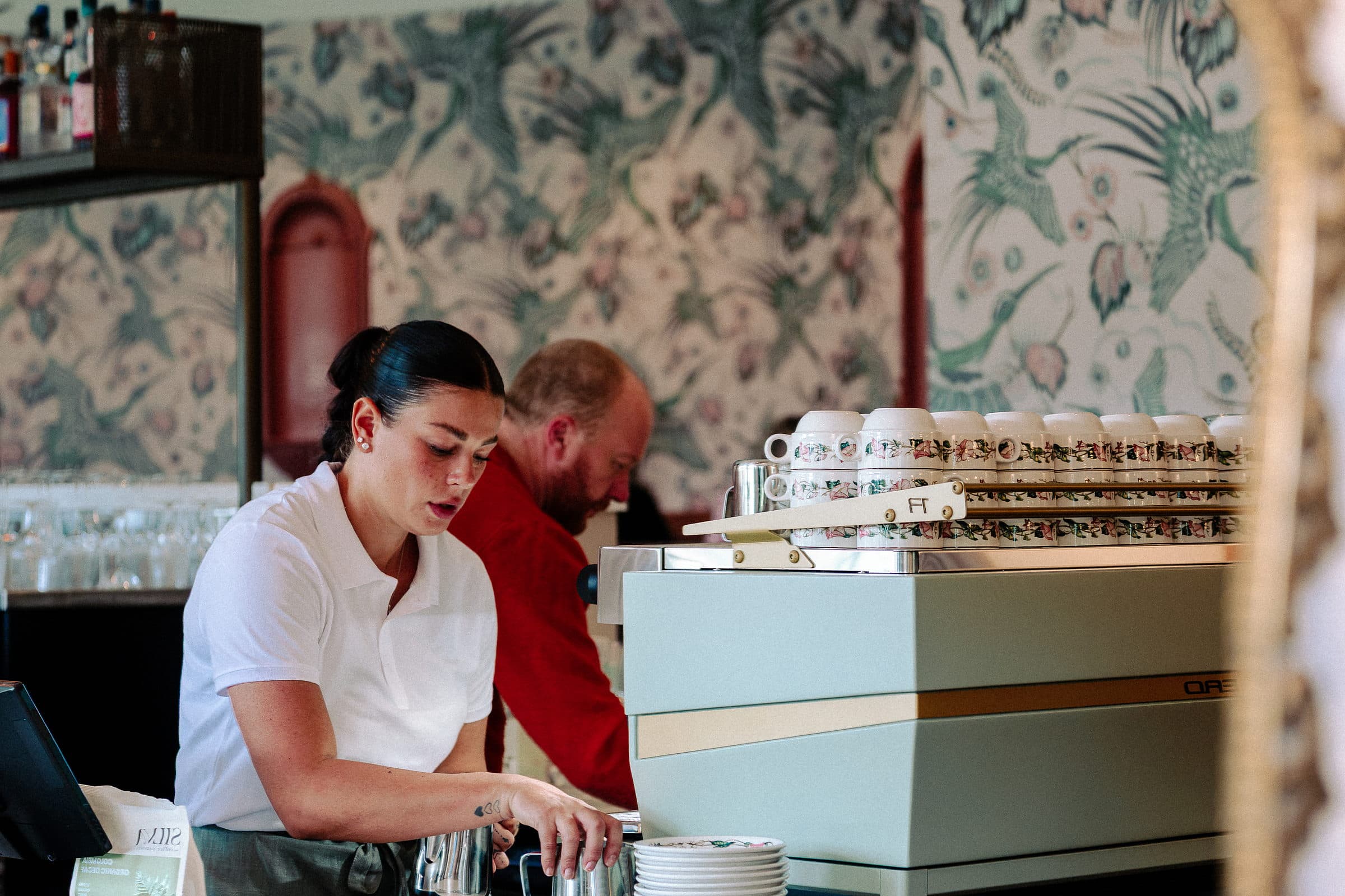 A barista pulling an espresso at Clover Cottage