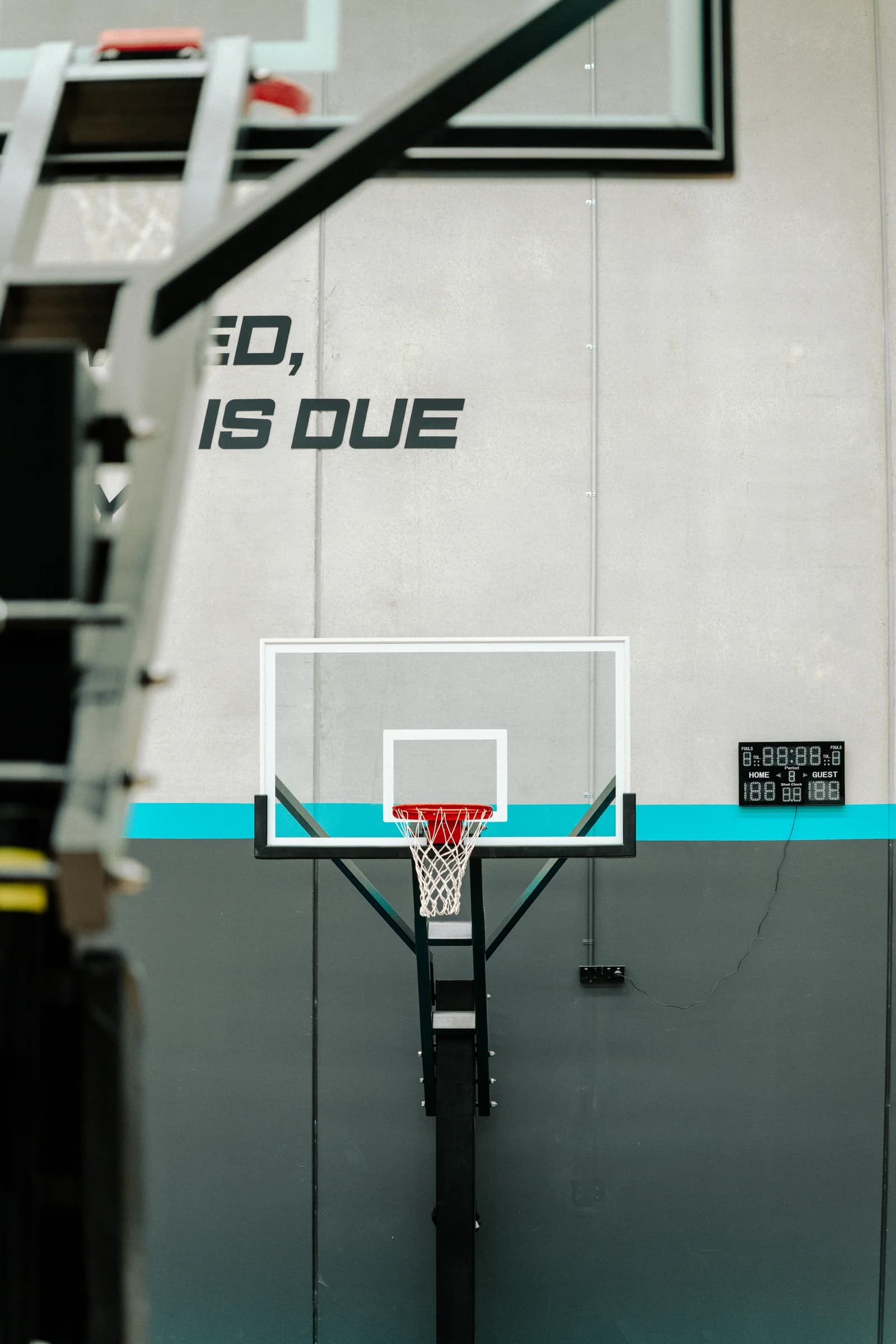 Basketball backboard, rim and court signage at Hoops Culture HQ