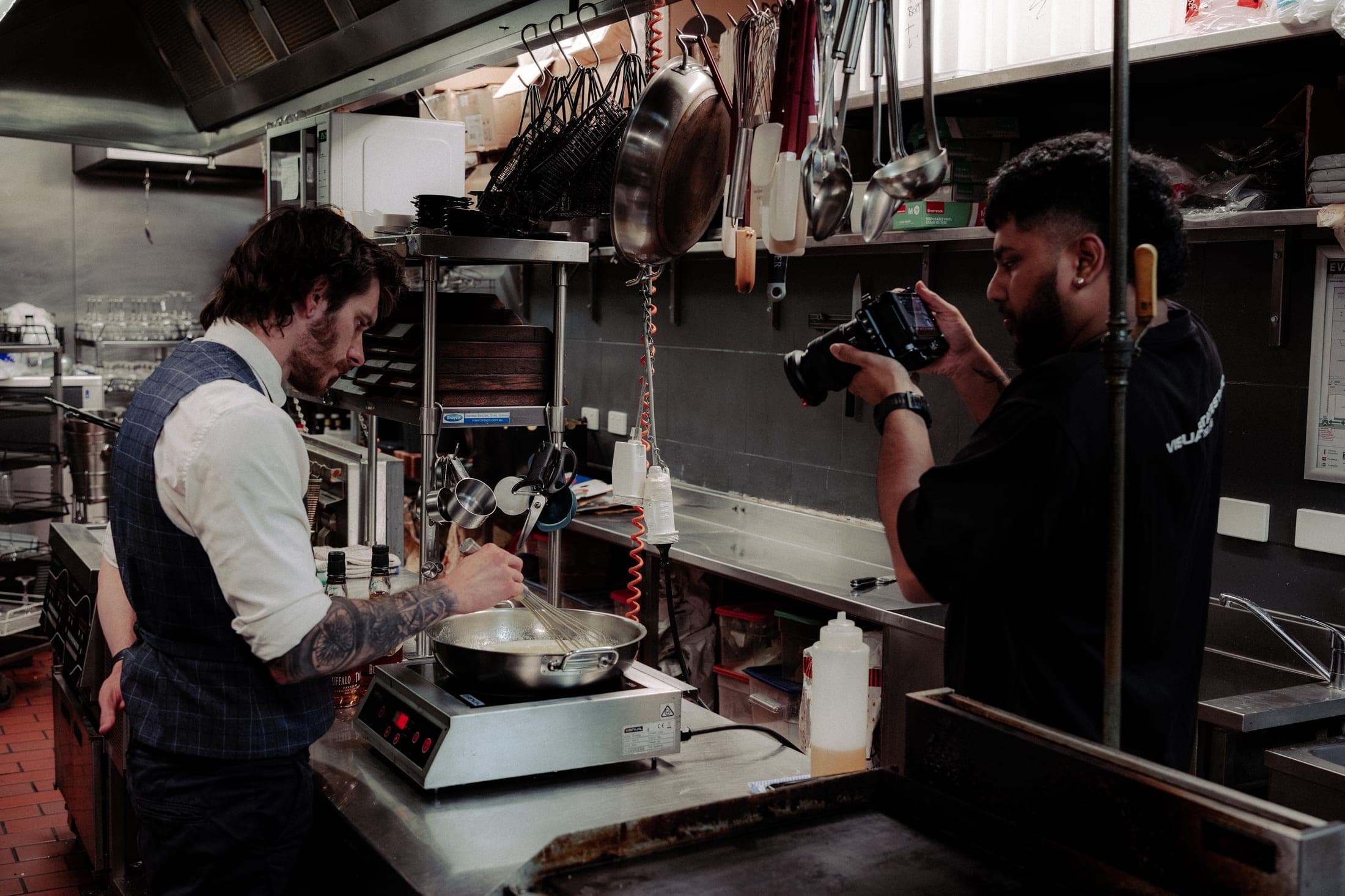 Behind the scenes on a Visual State photography shoot in a commercial kitchen