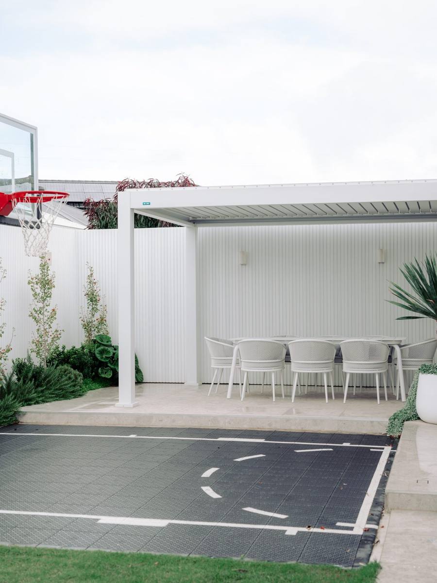 HR Homestyle Projects — backyard basketball court and alfresco dining area